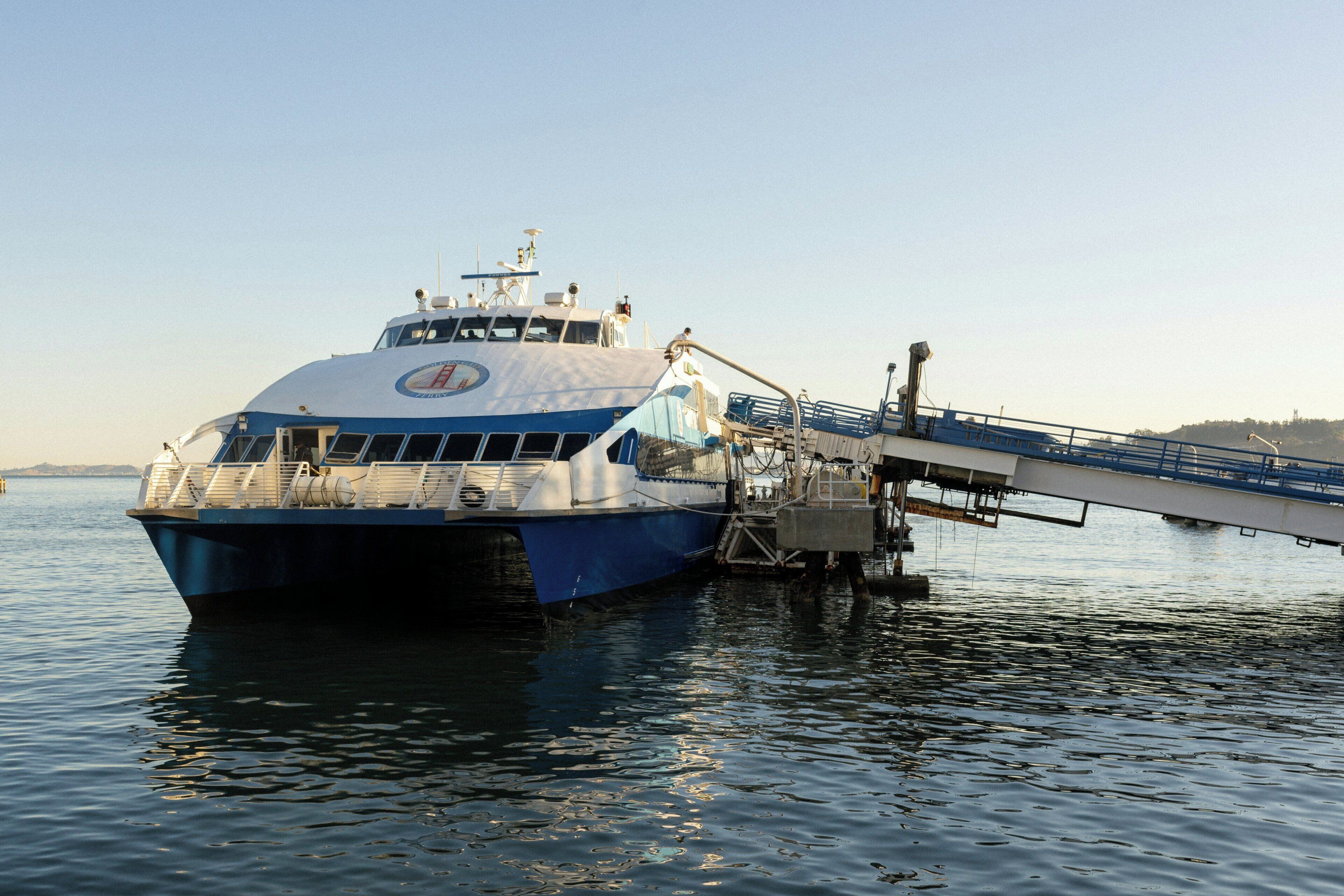 A ferry with a ramp extending over the water, likely for loading or unloading vehicles.