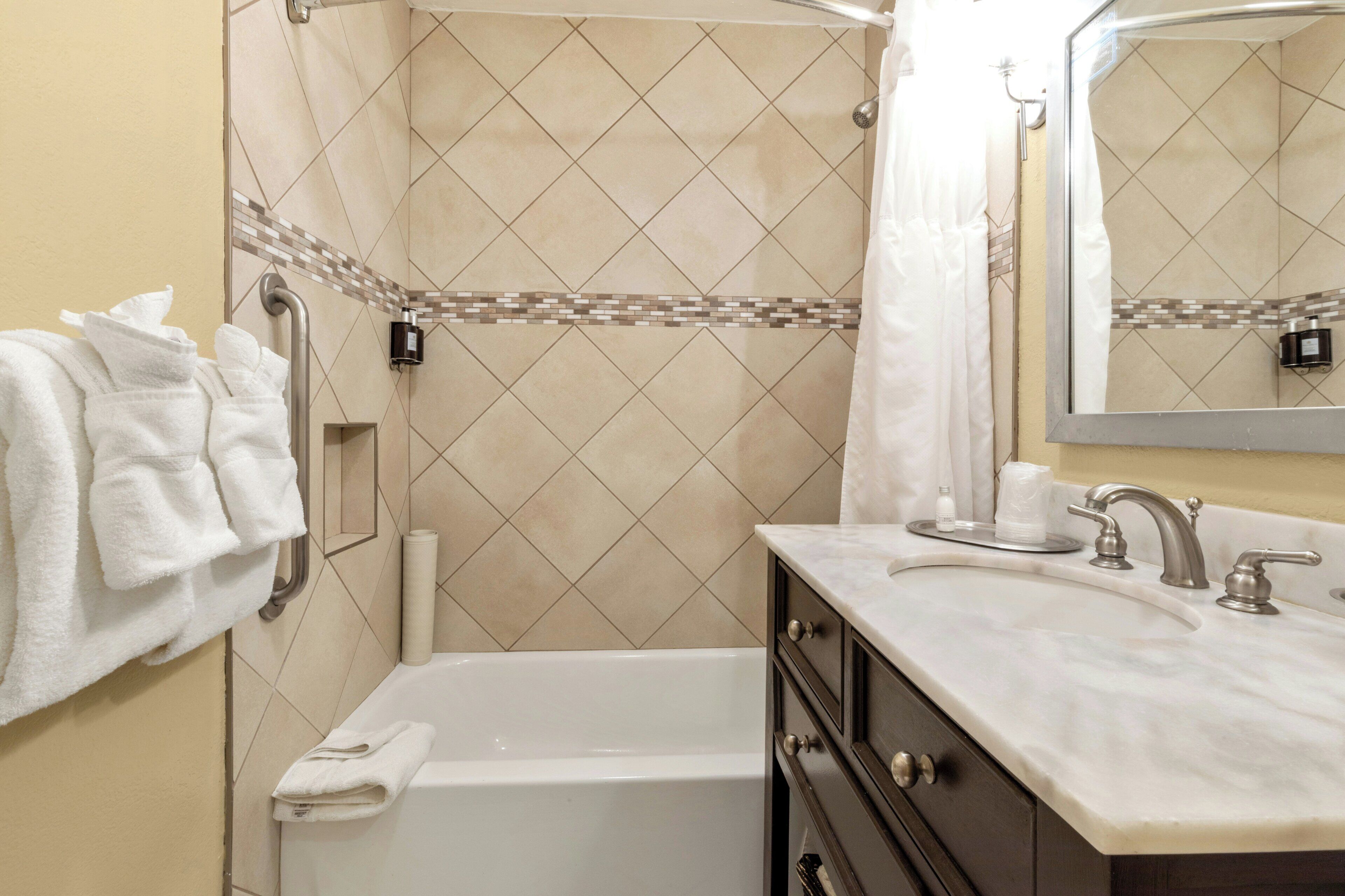 Combined shower/tub, hair dryer, towels, soap