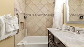 Combined shower/tub, hair dryer, towels, soap