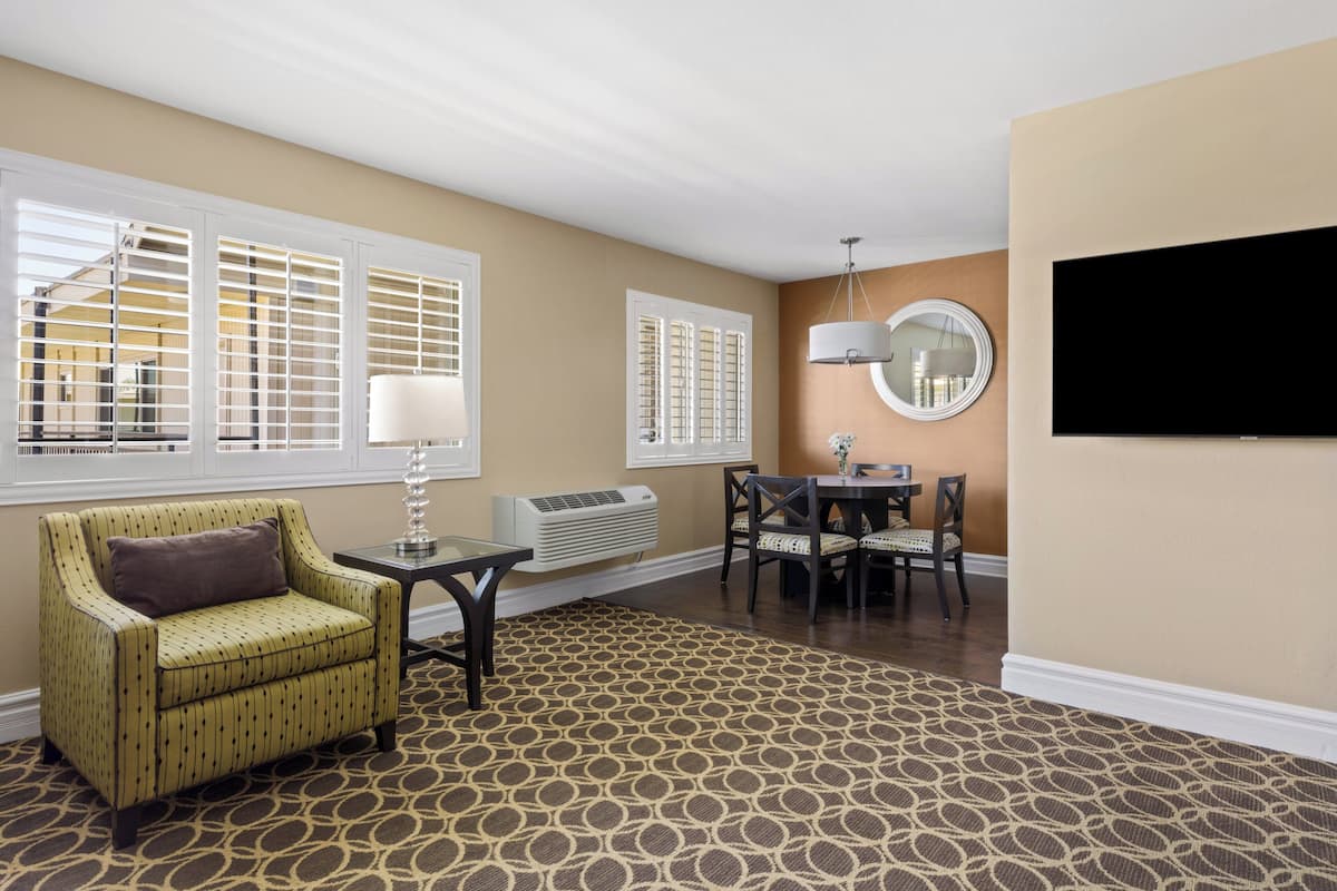 Suite, 1 Bedroom (Garden Side, 2 Queens) | Living area | 42-inch LCD TV with satellite channels, TV