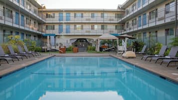 Outdoor pool, open 10:00 AM to 9:00 PM, pool umbrellas, pool loungers
