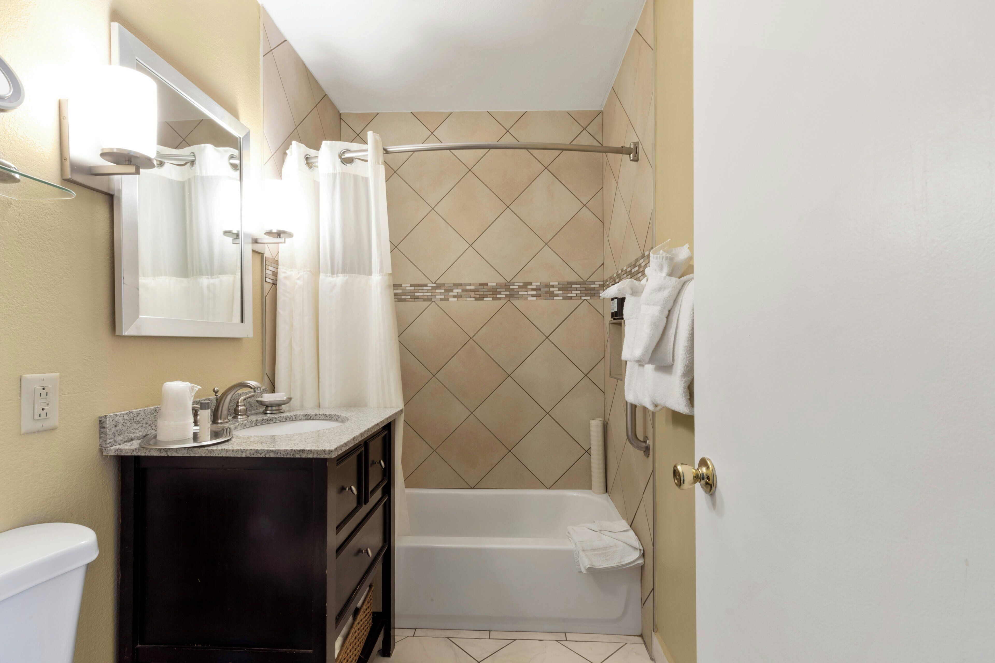 Combined shower/tub, hair dryer, towels, soap