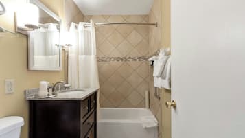 Combined shower/tub, hair dryer, towels, soap
