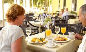 Guests can enjoy a delicious breakfast for two in this inviting dining area.