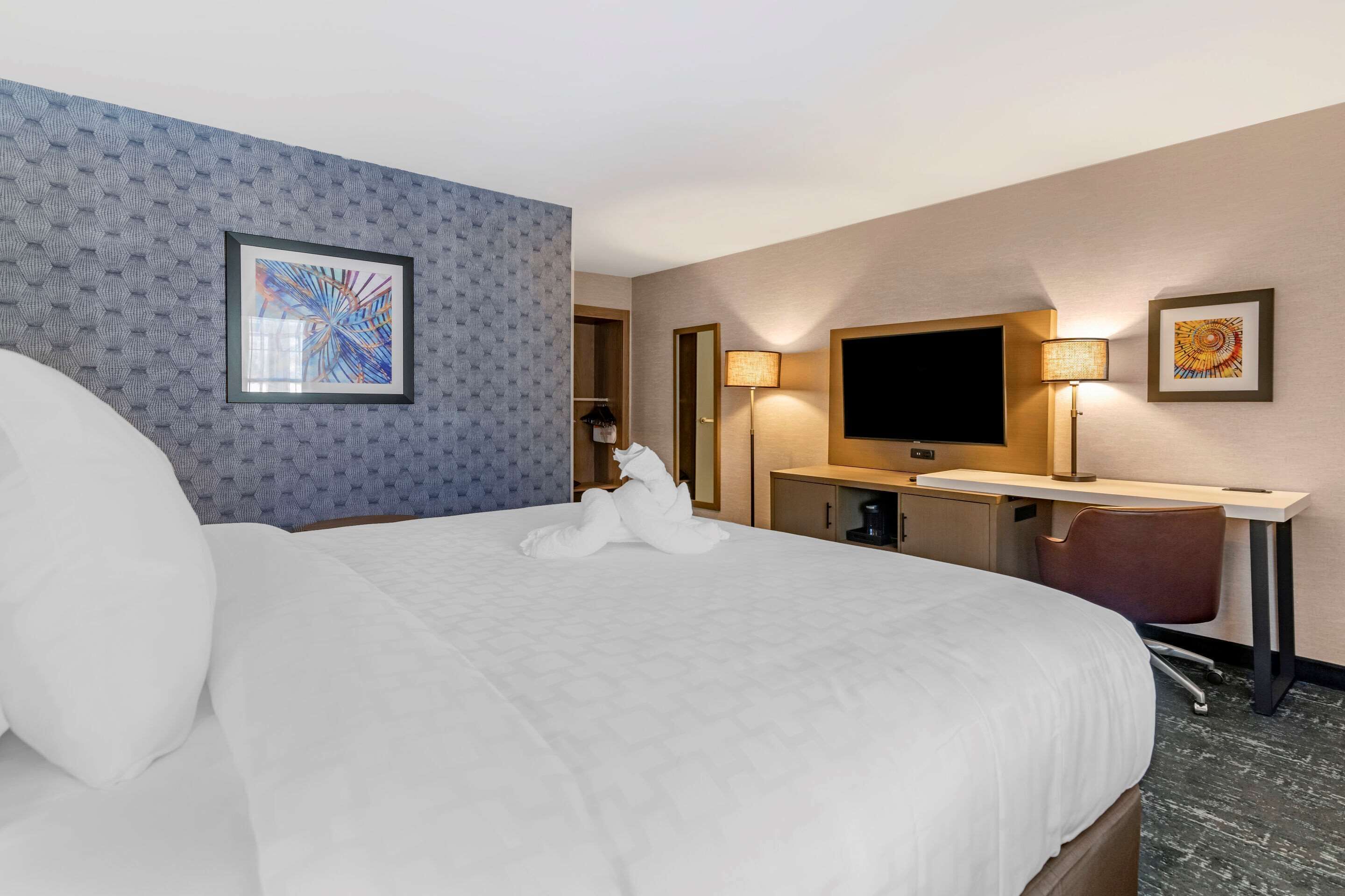 desk, laptop workspace, blackout curtains, iron/ironing board