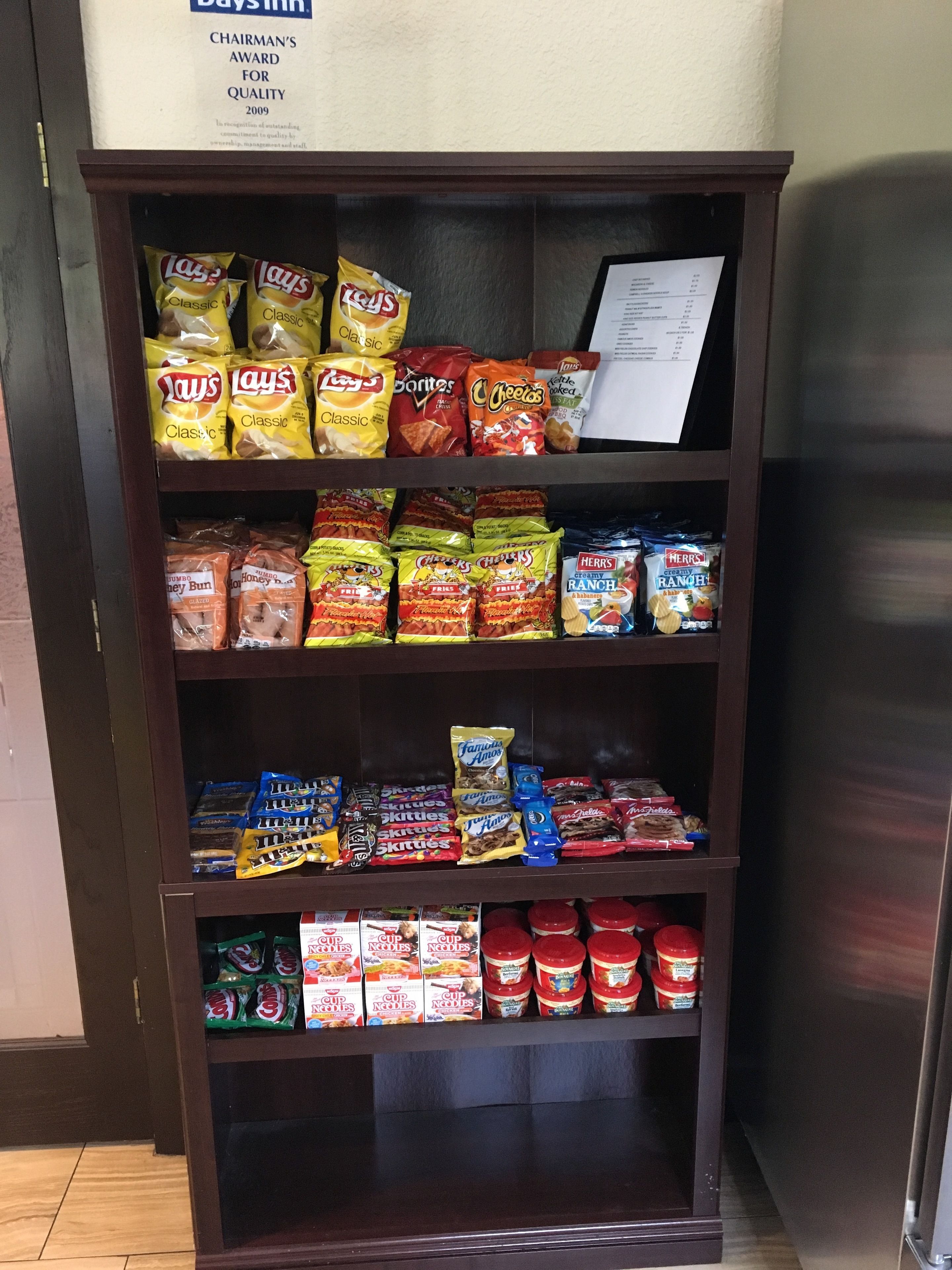 A snack display with various chips and snacks.