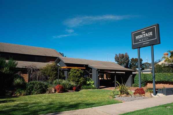 Set amidst beautifully maintained gardens, The Heritage Motel offers a modern architectural design with a flat roof and covered entrance.