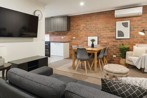 Family Apartment, 3 Bedrooms, Non Smoking, Balcony | Living area | 45-inch Smart TV with digital channels, Netflix, streaming services