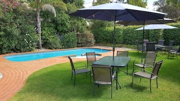 Seasonal outdoor pool, open 8:30 AM to 8:30 PM, pool umbrellas