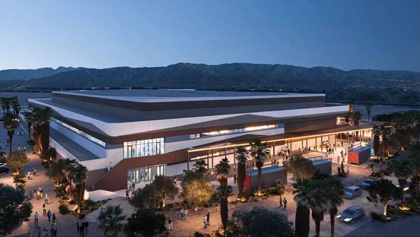 A modern building with a flat roof and large windows, surrounded by palm trees and a parking area. - Holiday Inn Express Palm-Desert by IHG (Palm Desert)