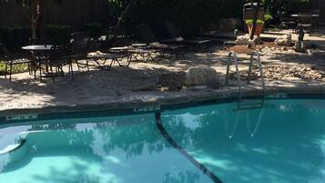 Outdoor pool, open 9:00 AM to 10:00 PM, pool umbrellas, sun loungers