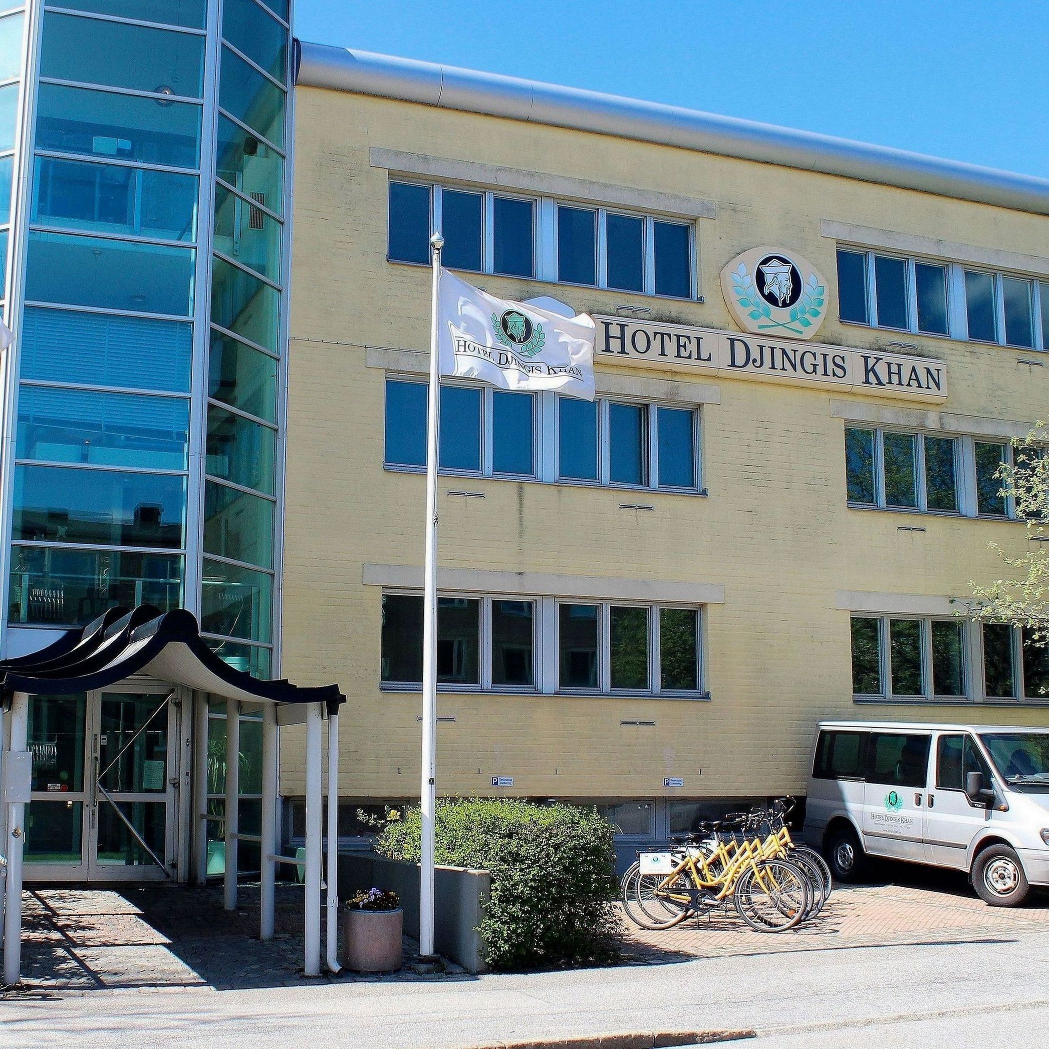 A hotel building with a sign reading 'Hotel Djingis Khan.'
