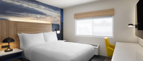 Quarto de hotel moderno com cama, mesa de cabeceira, abajur e janela com persianas.