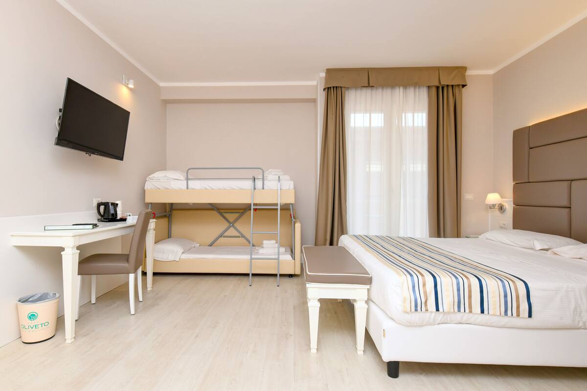 Superior Quadruple Room | Minibar, in-room safe, iron/ironing board (on request), alarm clocks