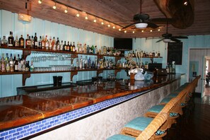 2 bars/lounges, poolside bar, beach bar