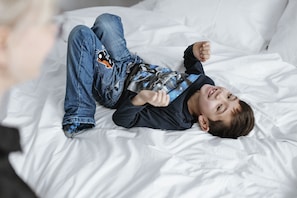 Premium bedding, desk, laptop workspace, blackout drapes