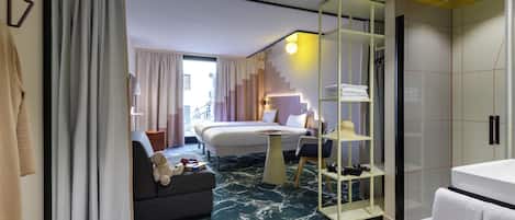 Premium bedding, desk, laptop workspace, blackout drapes