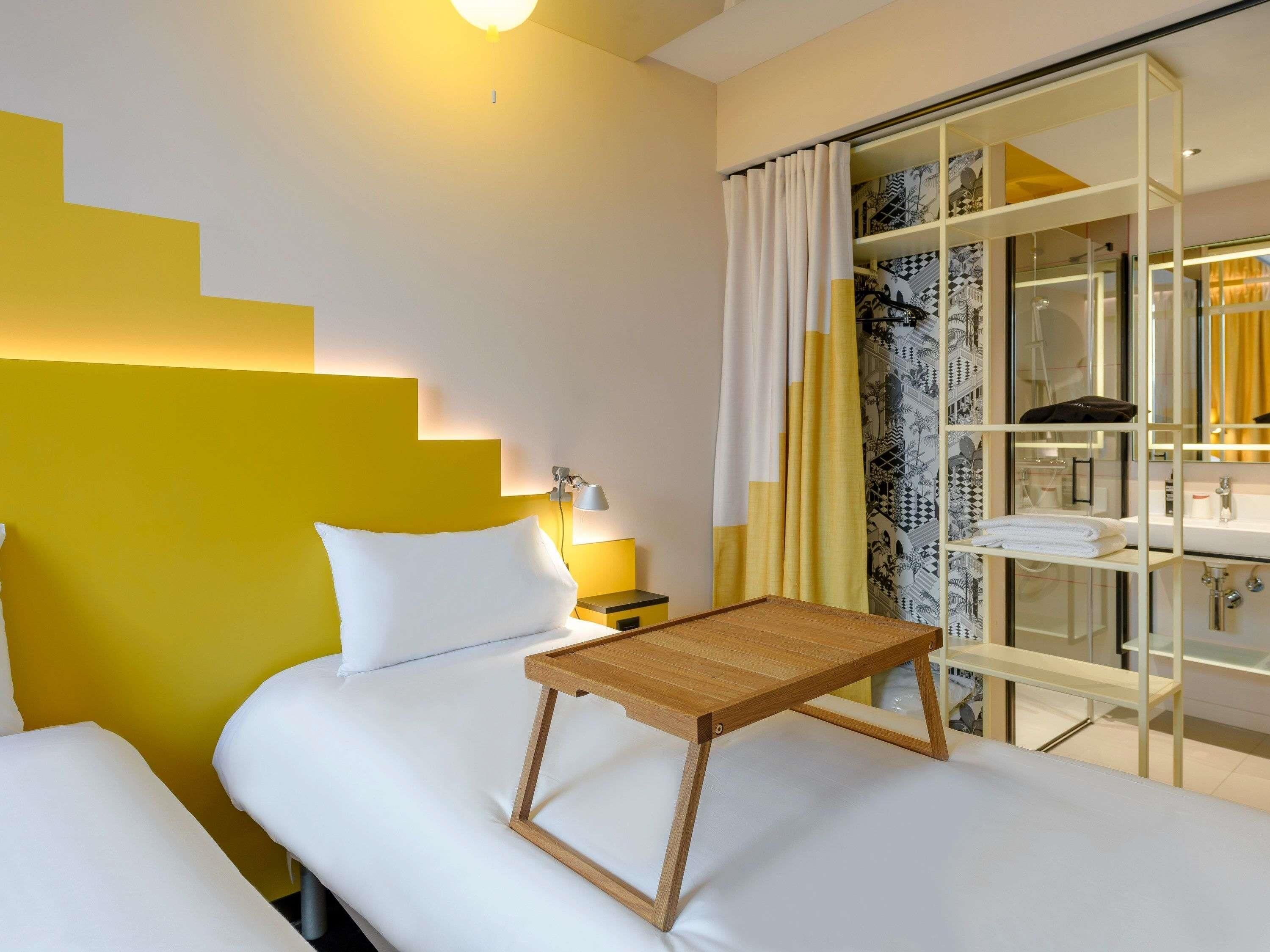 Premium bedding, desk, laptop workspace, blackout curtains