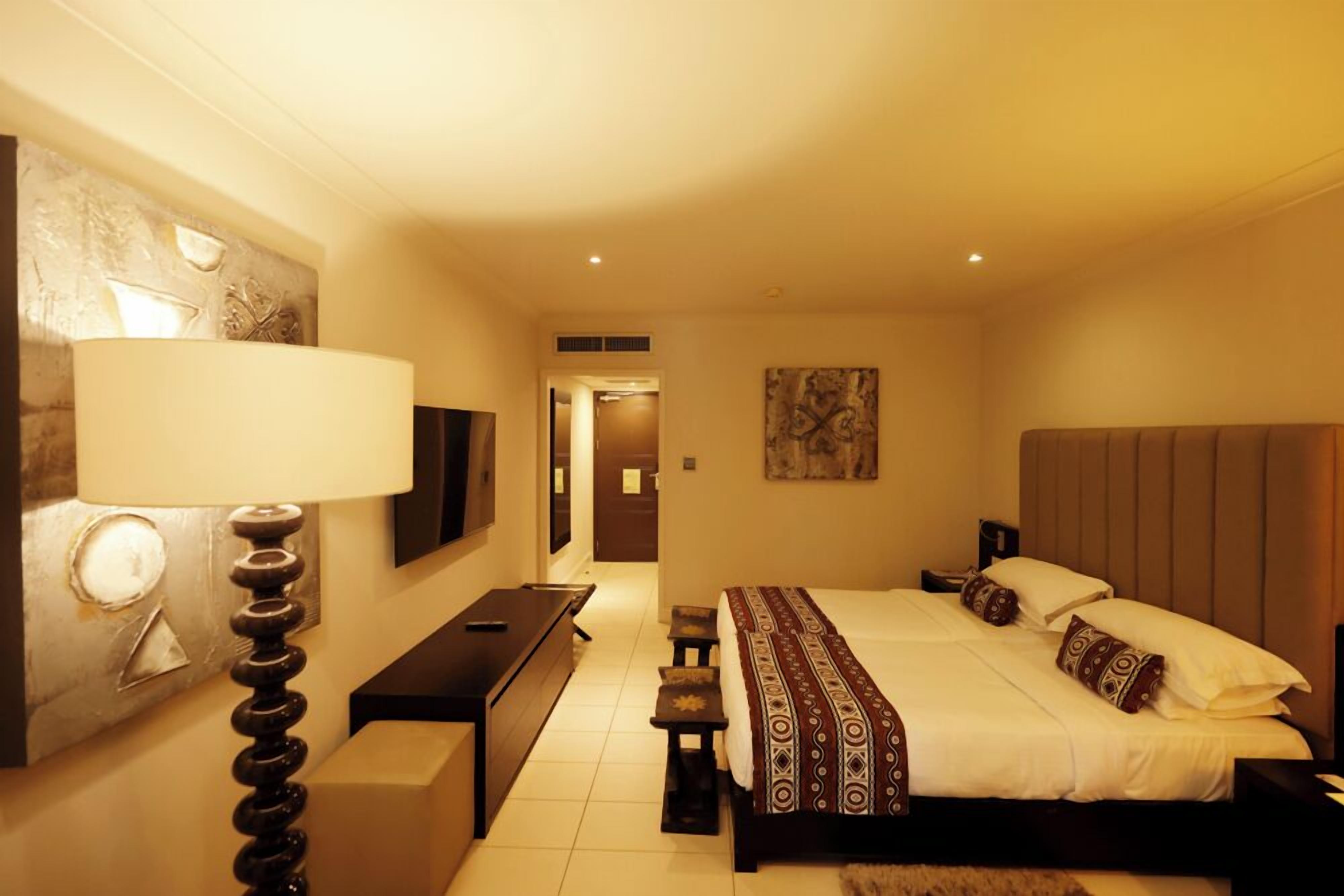 Separate tub and shower, hydromassage showerhead, designer toiletries