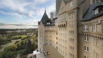 A large, historic building with multiple floors and a prominent tower.