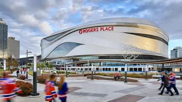 A modern architectural building with a curved facade and a prominent "Rogers Place" sign.