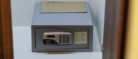 A security keypad with a card slot and a small instruction label.