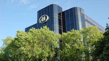 A modern building with a distinctive logo on the facade.