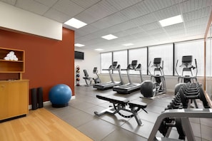 Stay fit and active with our well-equipped gym featuring treadmills, elliptical machines, free weights, and an exercise ball.