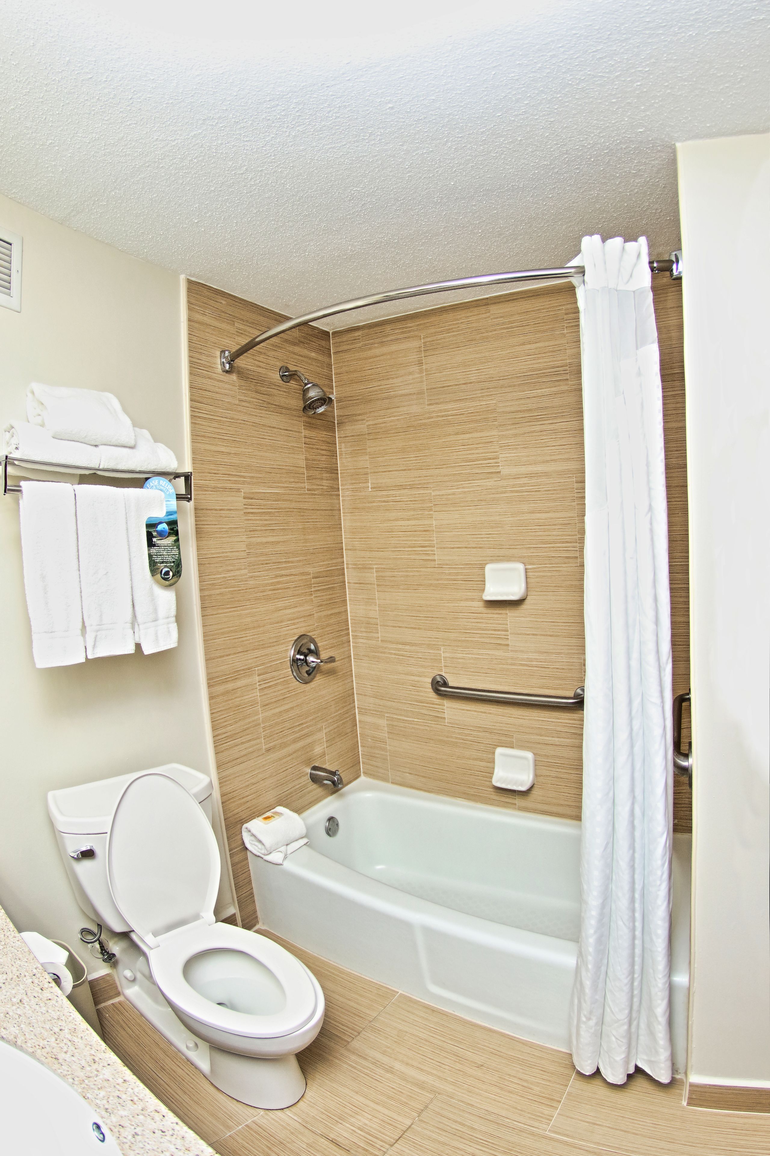 combined shower/bathtub, eco-friendly toiletries, hair dryer, towels