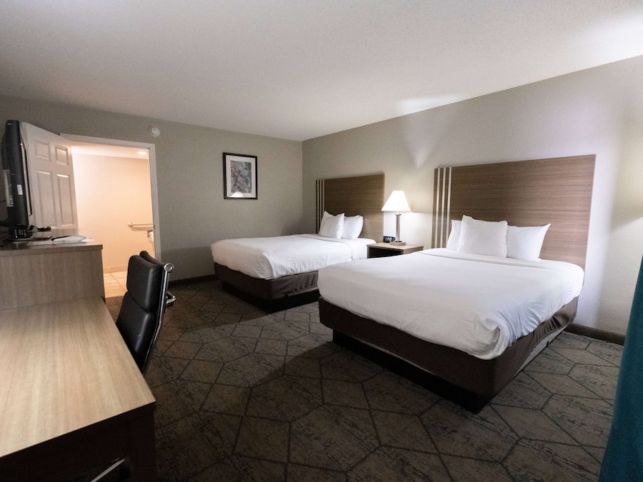 Desk, laptop workspace, blackout drapes, iron/ironing board