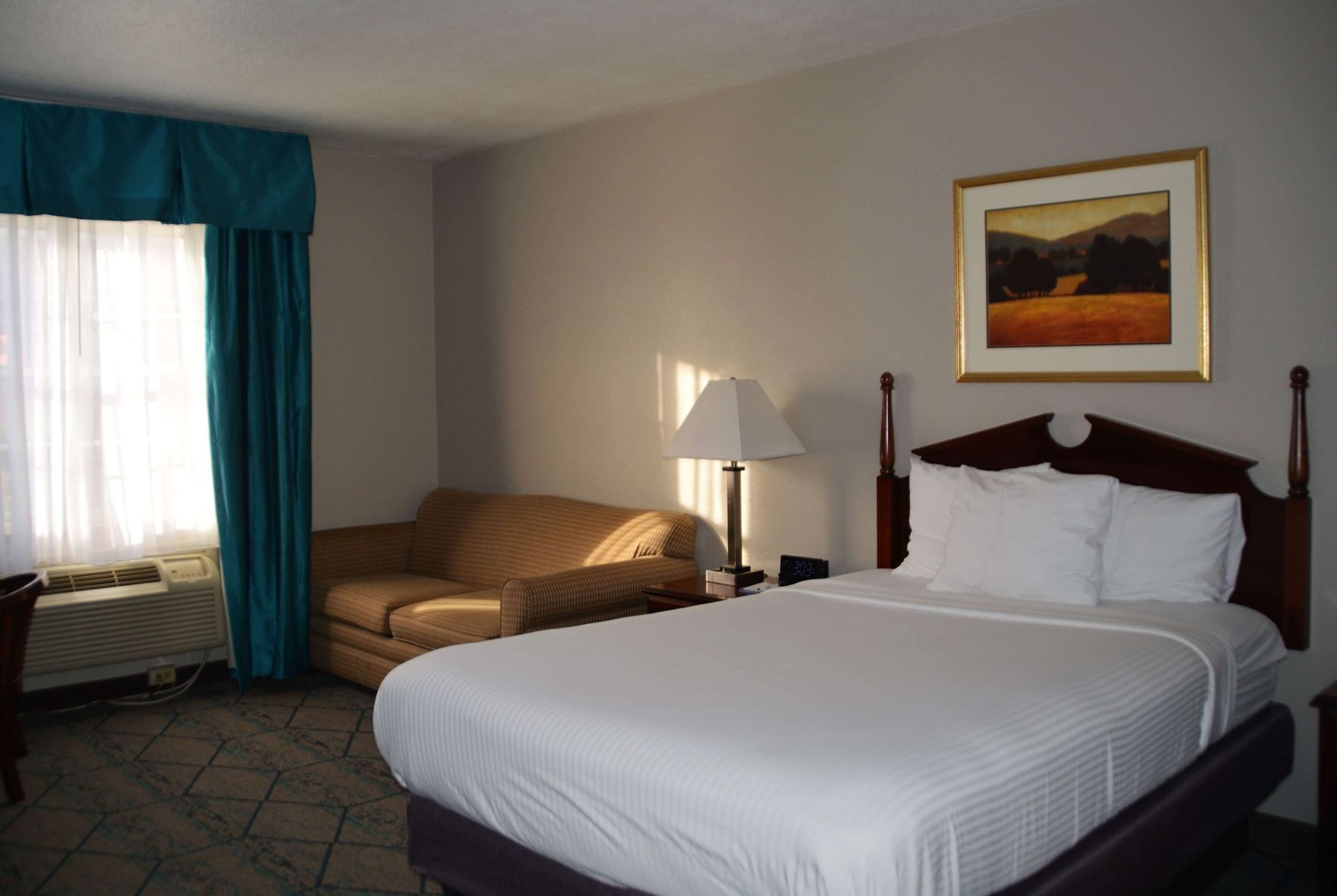 Desk, laptop workspace, blackout drapes, iron/ironing board