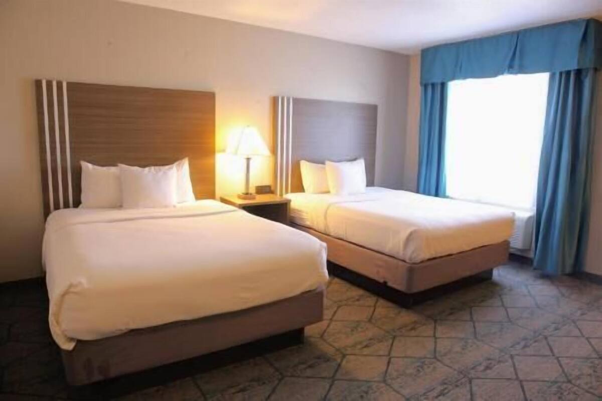 Desk, laptop workspace, blackout drapes, iron/ironing board