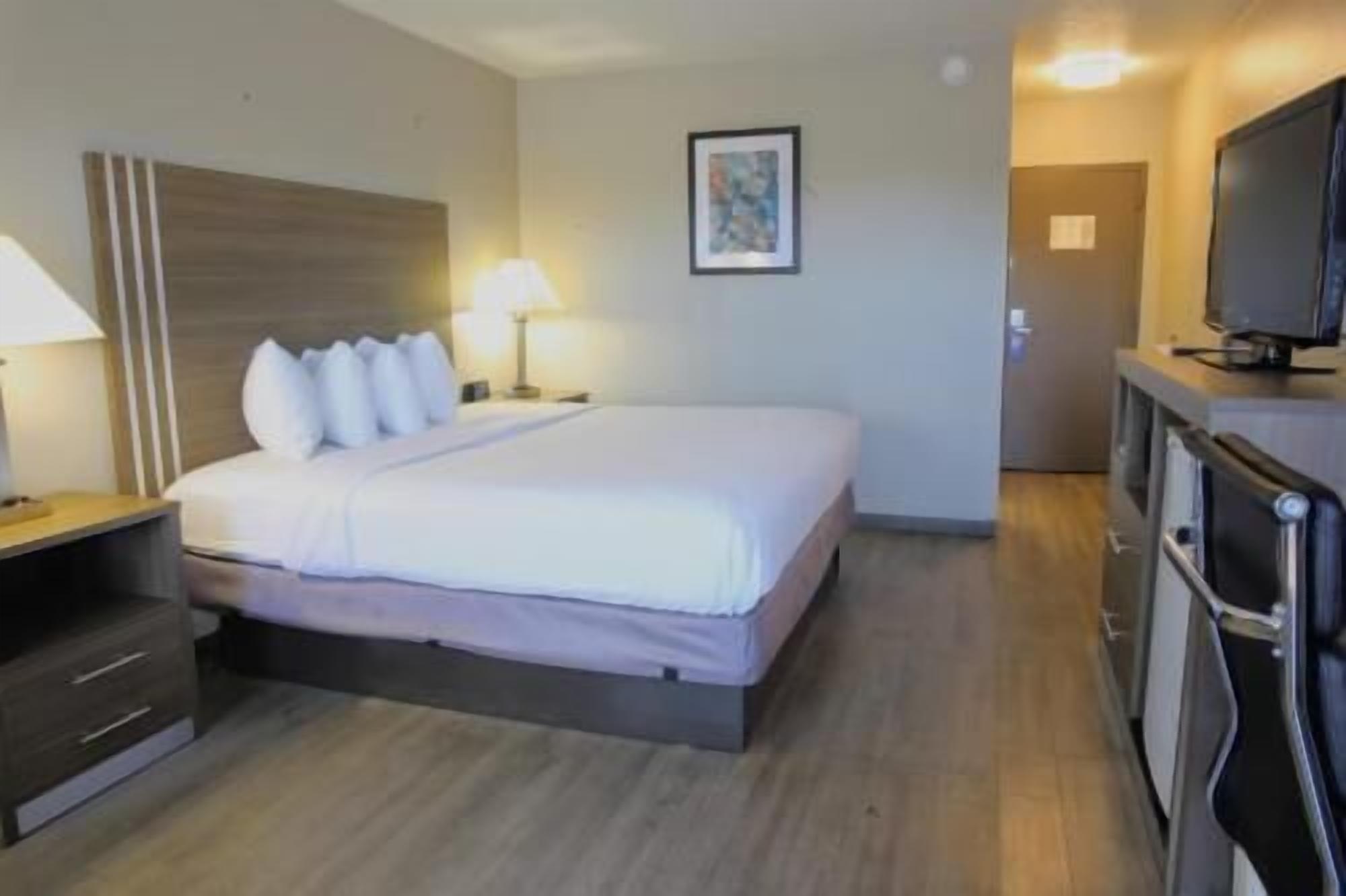 Desk, laptop workspace, blackout drapes, iron/ironing board