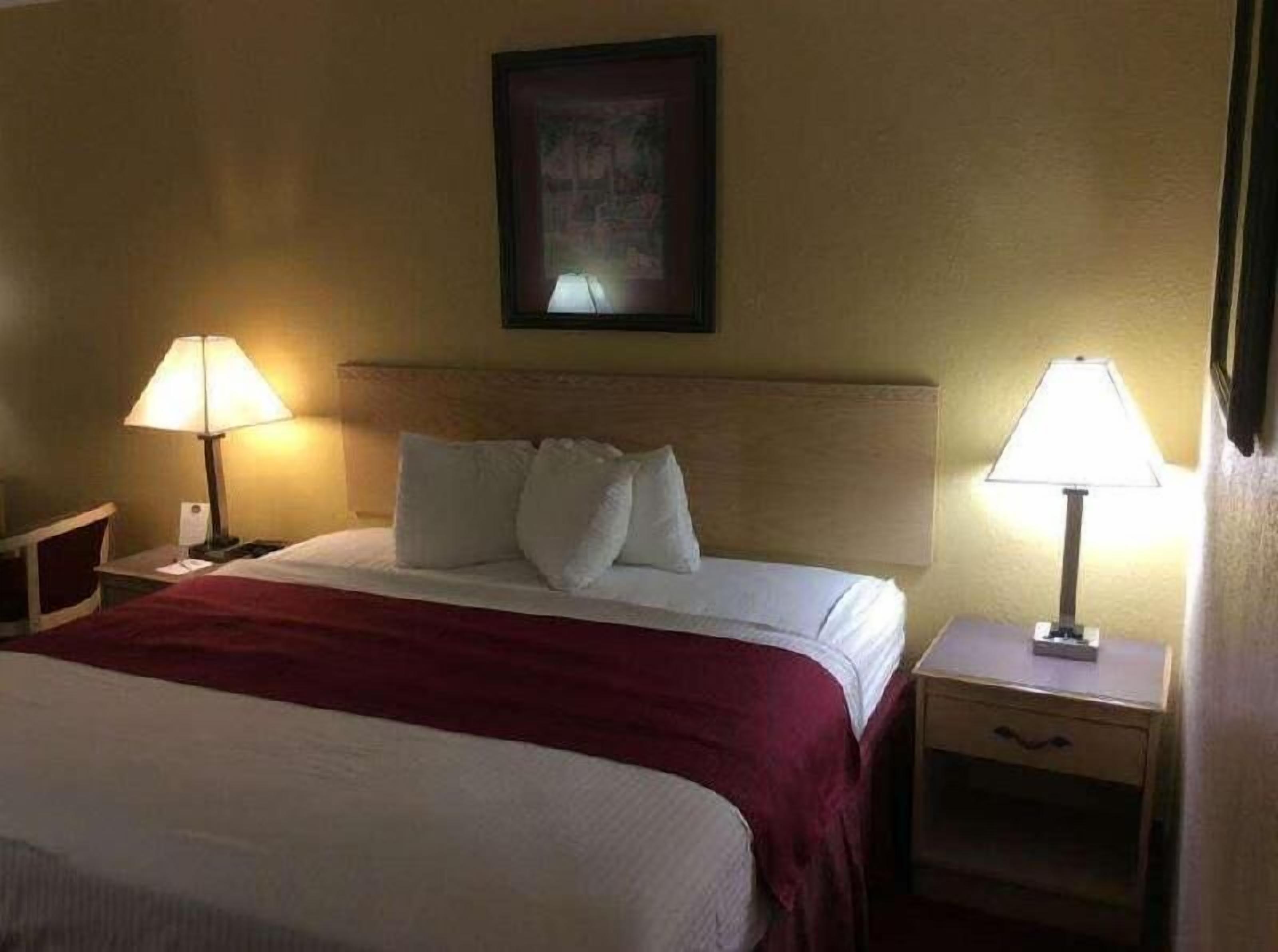 Desk, laptop workspace, blackout drapes, iron/ironing board