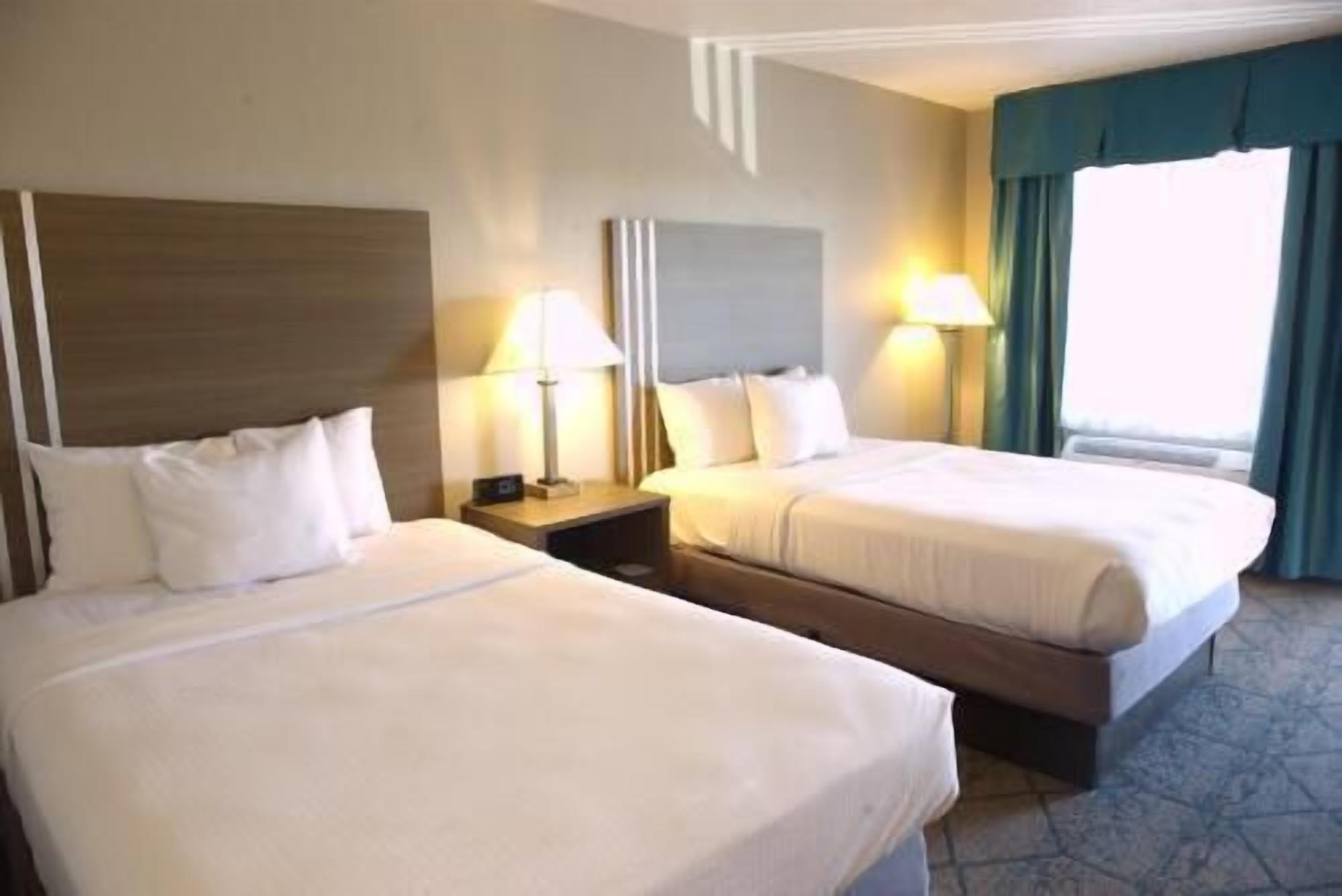 Desk, laptop workspace, blackout drapes, iron/ironing board