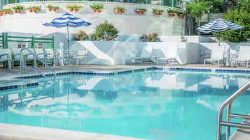 Seasonal outdoor pool, open 9:00 AM to 9:00 PM, pool umbrellas