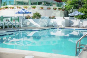 Seasonal outdoor pool, open 9:00 AM to 9:00 PM, pool umbrellas