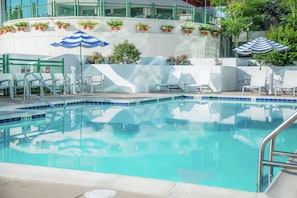 Seasonal outdoor pool, open 9:00 AM to 9:00 PM, pool umbrellas