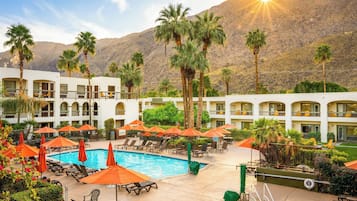 Outdoor pool, a heated pool, open 8:00 AM to 10:00 PM, pool umbrellas