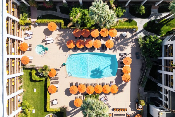 Outdoor pool, a heated pool, open 8:00 AM to 10:00 PM, pool umbrellas