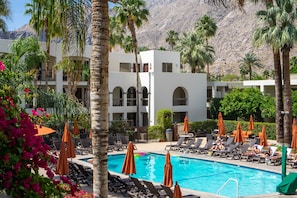 Outdoor pool, a heated pool, open 8:00 AM to 10:00 PM, pool umbrellas