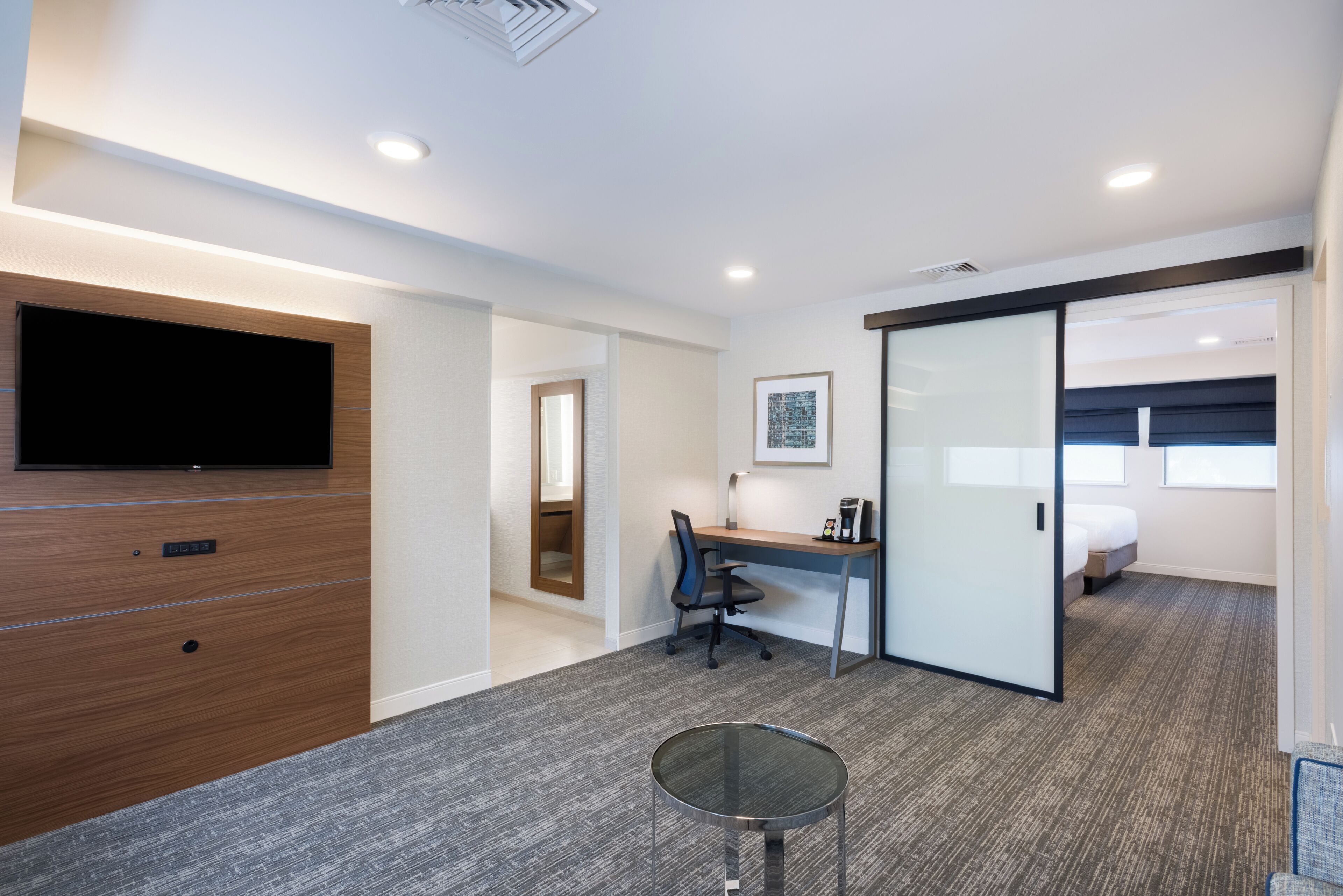 hypo-allergenic bedding, desk, laptop workspace, blackout curtains