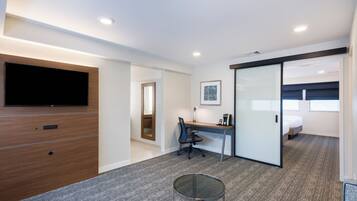 Hypo-allergenic bedding, desk, laptop workspace, blackout drapes