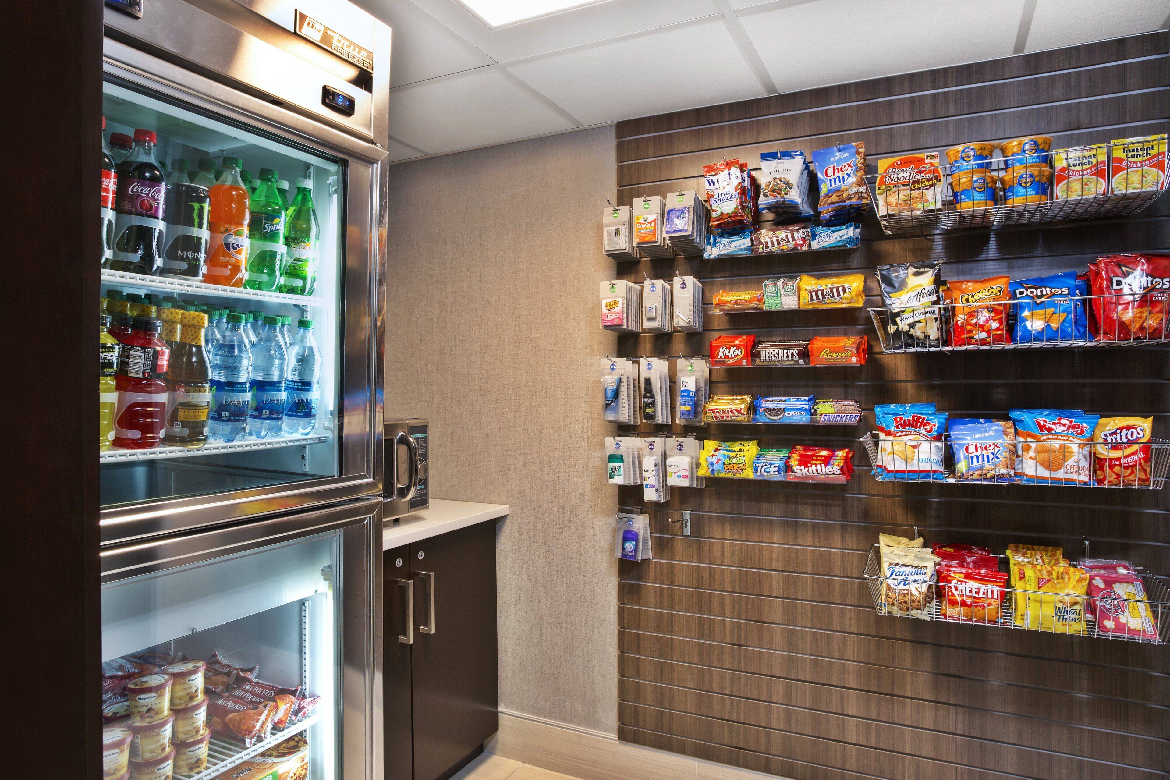 A vending machine with various beverages and snacks, including sodas, water, and chips.