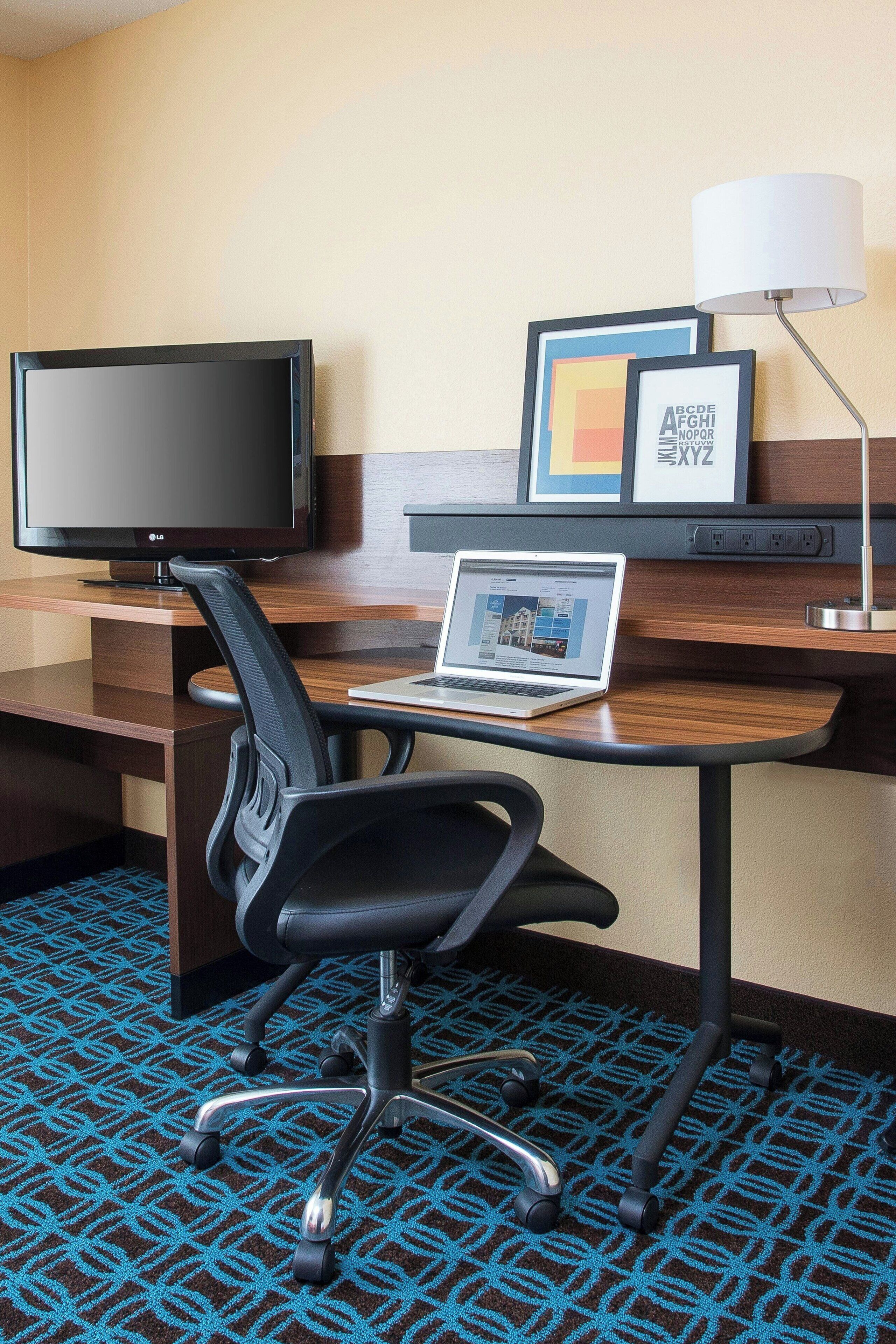 premium bedding, desk, laptop workspace, blackout curtains