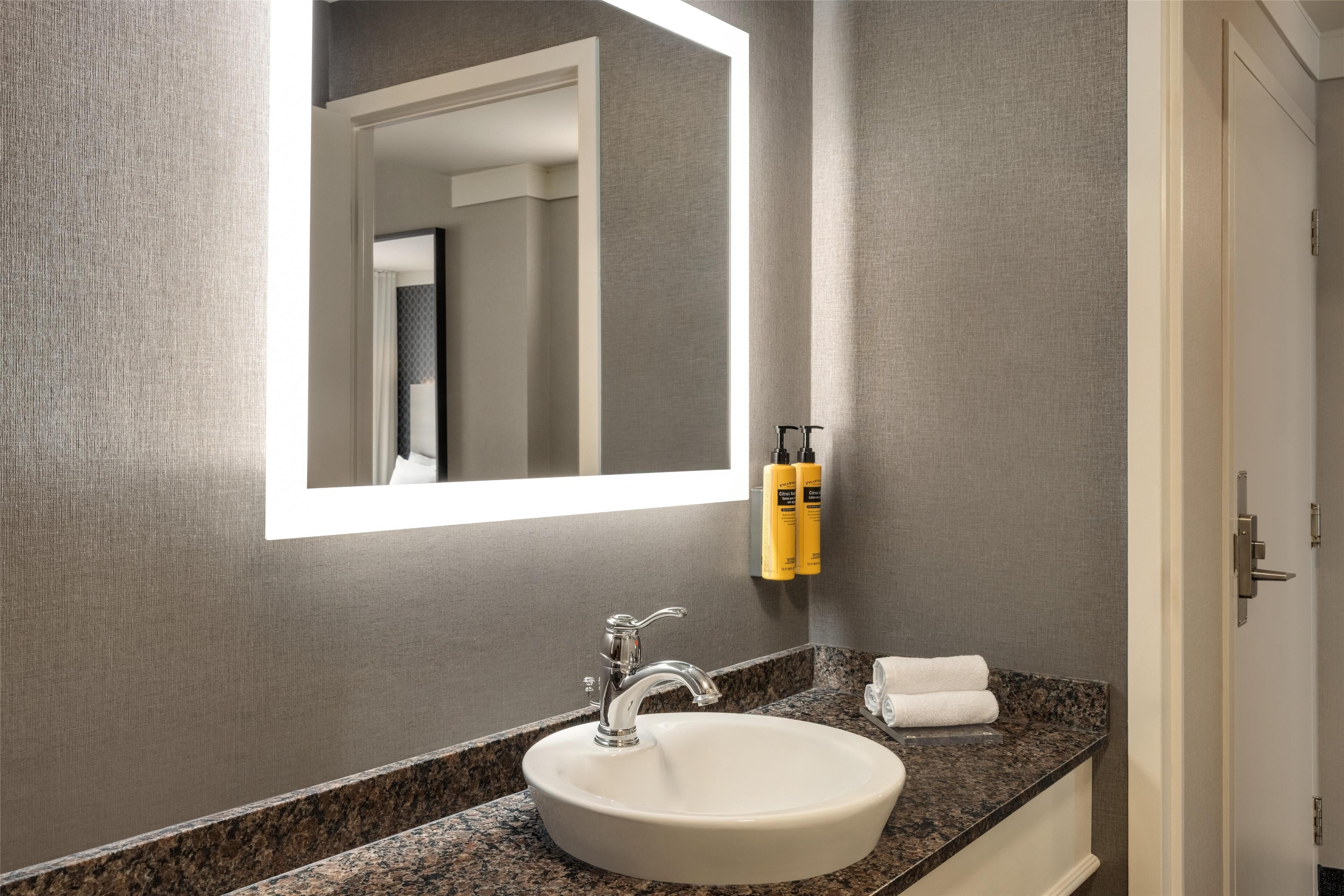 eco-friendly toiletries, hair dryer, towels