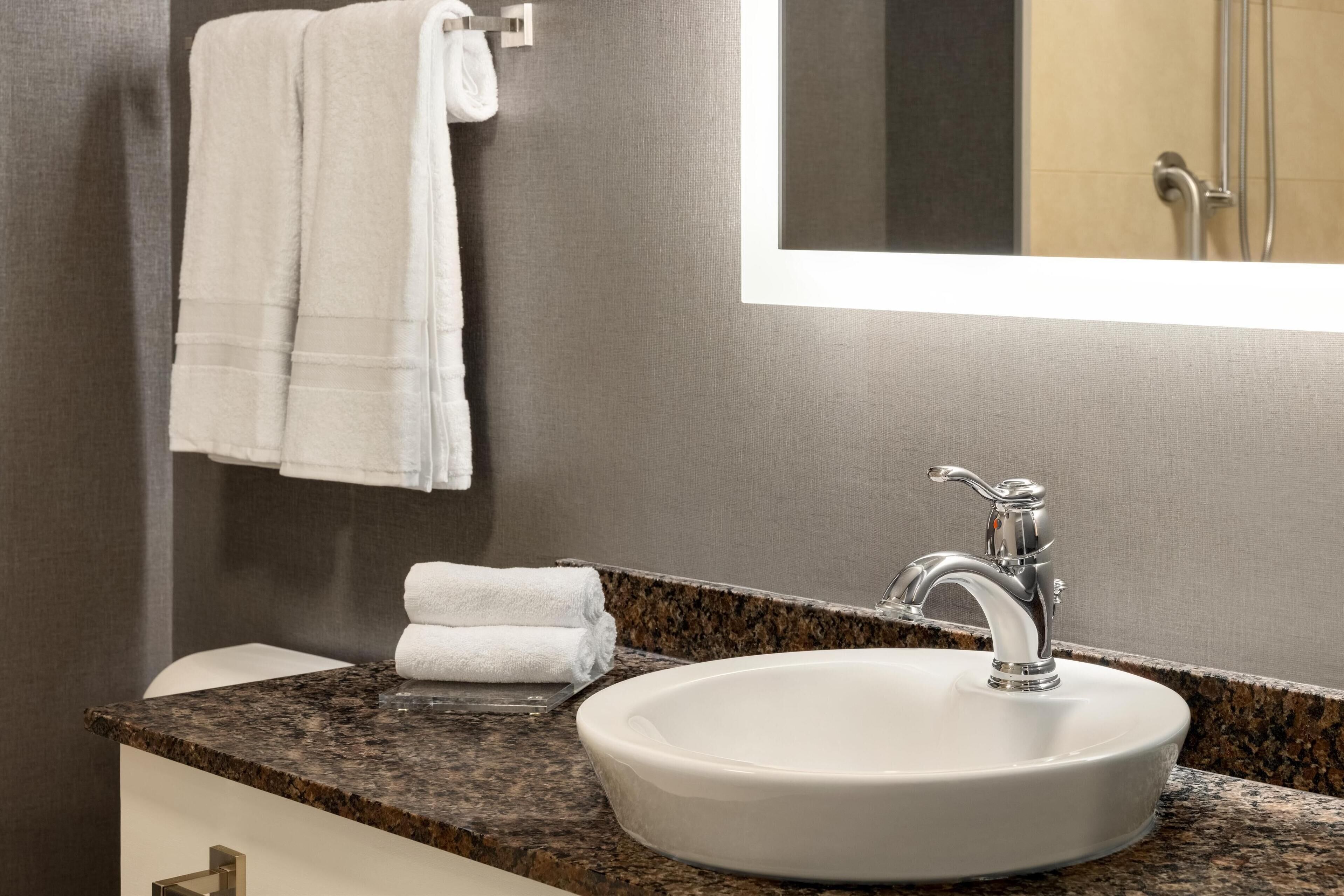 eco-friendly toiletries, hair dryer, towels