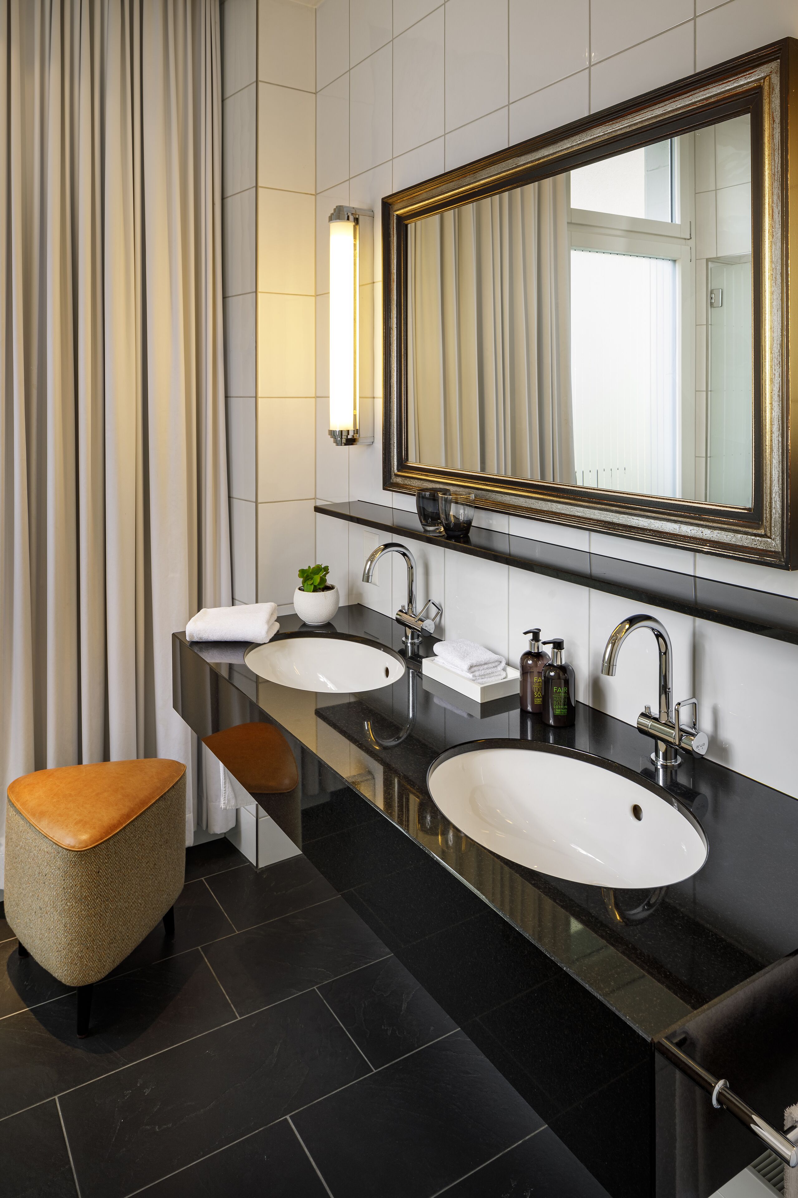 opera deluxe | bathroom | eco-friendly toiletries, hair dryer, slippers, towels