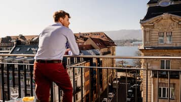 Guests can enjoy stunning city views from the balcony, taking in the sights of the river below.
