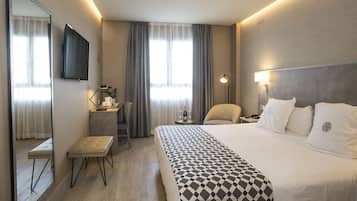 Luxe beddengoed, donzen dekbedden, pillowtop-bedden, een minibar